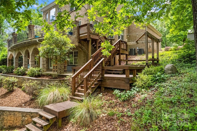 141 Ridge Top Rd, Mooresville, NC 28117 - rear view of house featuring stairs, brick siding, central AC, and a balcony