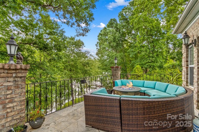 141 Ridge Top Rd, Mooresville, NC 28117 - view of patio / terrace featuring an outdoor living space with a fire pit