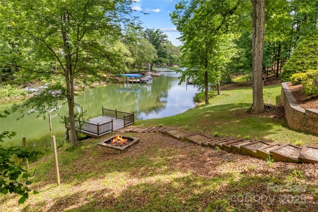 141 Ridge Top Rd, Mooresville, NC 28117 - view of green lawn featuring an outdoor fire pit and a water view