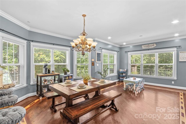 141 Ridge Top Rd, Mooresville, NC 28117 - dining room featuring wood finished floors, a chandelier, baseboards, crown molding, and recessed lighting