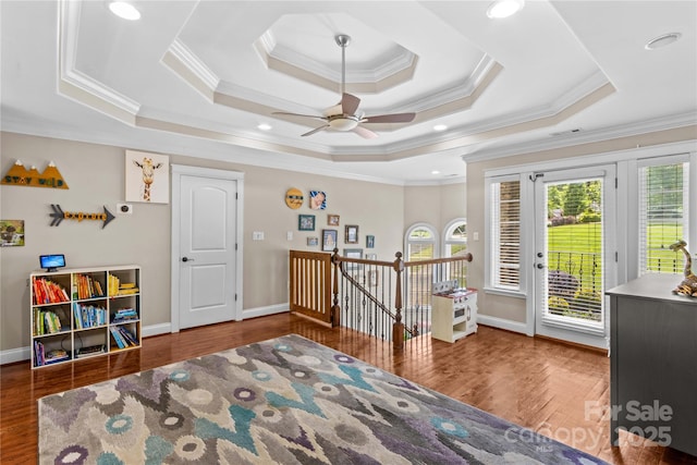 141 Ridge Top Rd, Mooresville, NC 28117 - living area featuring plenty of natural light, an upstairs landing, a raised ceiling, wood finished floors, and crown molding