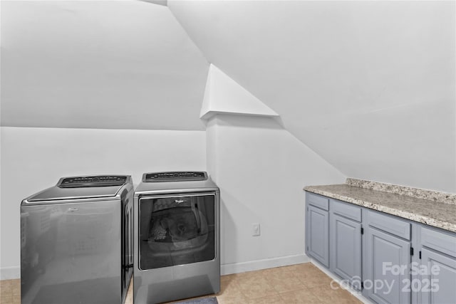 141 Ridge Top Rd, Mooresville, NC 28117 - laundry room featuring washer and dryer, cabinet space, light tile patterned flooring, and baseboards