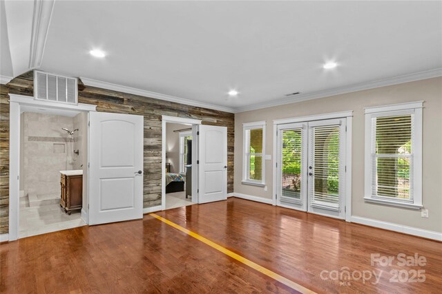 141 Ridge Top Rd, Mooresville, NC 28117 - empty room featuring crown molding, baseboards, wood finished floors, recessed lighting, and french doors