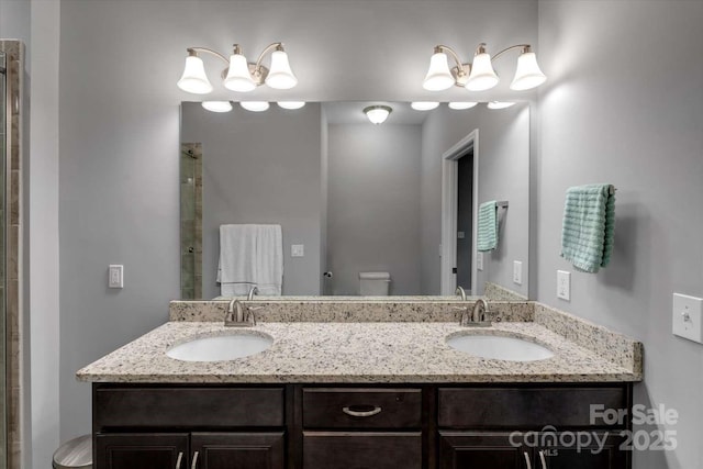 full bathroom featuring toilet, an enclosed shower, and double vanity