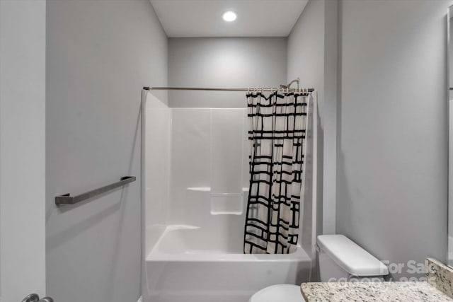 bathroom featuring toilet and shower / bath combo