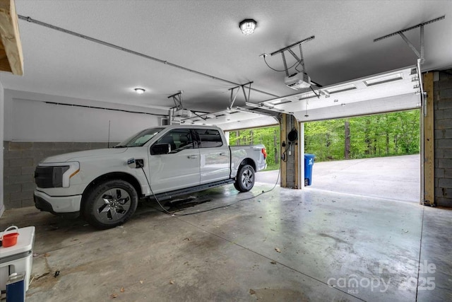 36 Nader Ave, Weaverville, NC 28787 - garage featuring concrete block wall and a garage door opener
