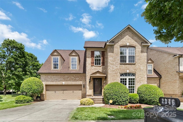 2346 Donnington Ln NW, Concord, NC 28027 - view of front of property with brick siding, concrete driveway, and a garage