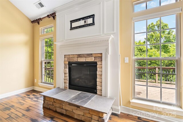 2346 Donnington Ln NW, Concord, NC 28027 - detailed view of wood finished floors, baseboards, and a glass covered fireplace
