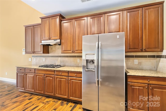 2346 Donnington Ln NW, Concord, NC 28027 - kitchen featuring stainless steel fridge, under cabinet range hood, gas stovetop, dark wood-style flooring, and baseboards