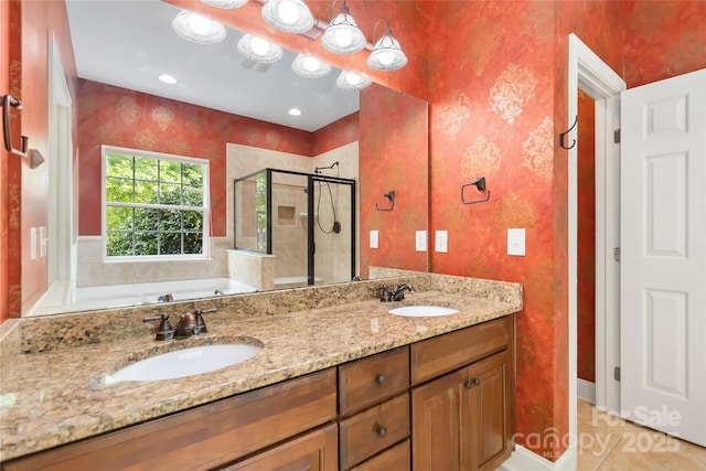 2346 Donnington Ln NW, Concord, NC 28027 - bathroom featuring a stall shower, a bath, double vanity, and tile patterned flooring