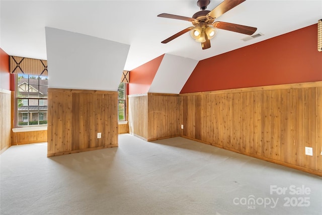 2346 Donnington Ln NW, Concord, NC 28027 - bonus room with wood walls, a ceiling fan, vaulted ceiling, baseboards, and carpet flooring