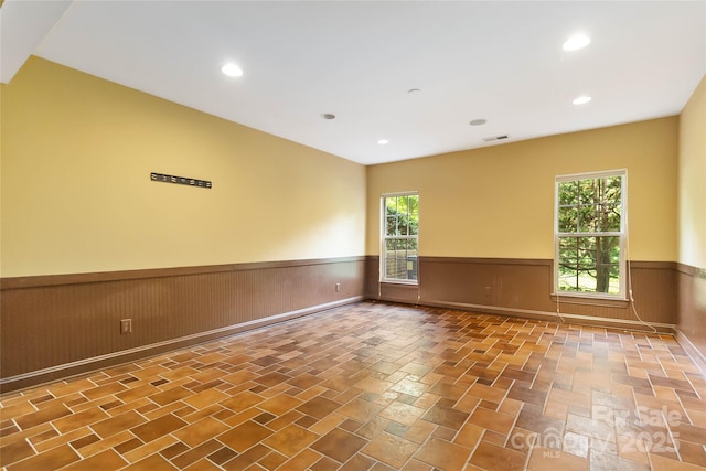2346 Donnington Ln NW, Concord, NC 28027 - unfurnished room with wainscoting and recessed lighting