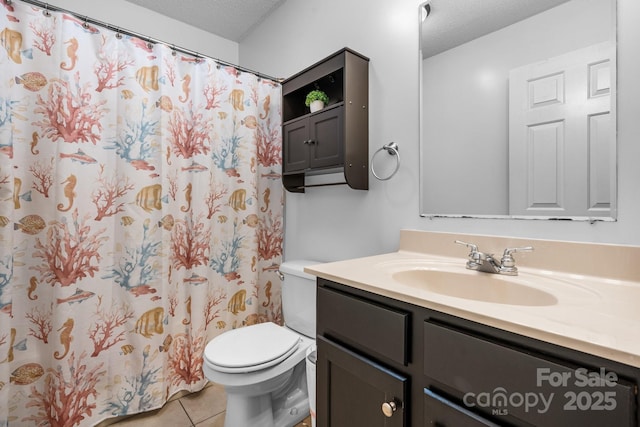 full bathroom featuring tile patterned floors, toilet, a textured ceiling, vanity, and a shower with curtain