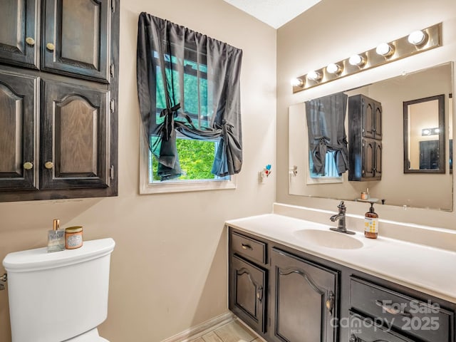 half bath with toilet and vanity