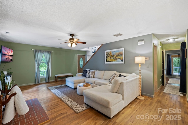 10 Kettle Creek Ln, Brevard, NC 28712 - living area with a textured ceiling, light wood-style floors, baseboards, and ceiling fan