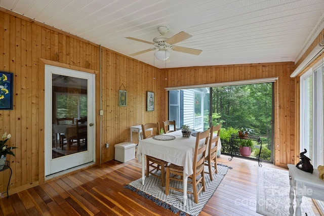 10 Kettle Creek Ln, Brevard, NC 28712 - dining area featuring wooden walls, hardwood / wood-style flooring, and a ceiling fan