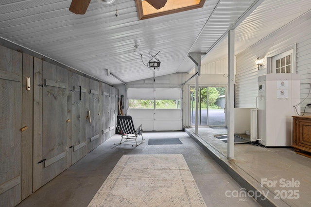 10 Kettle Creek Ln, Brevard, NC 28712 - garage with a garage door opener and a ceiling fan