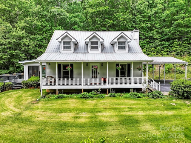 10 Kettle Creek Ln, Brevard, NC 28712 - farmhouse inspired home featuring covered porch, a front lawn, a chimney, a detached carport, and a wooded view