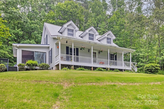 10 Kettle Creek Ln, Brevard, NC 28712 - view of front of house featuring a porch, a front lawn, and a metal roof