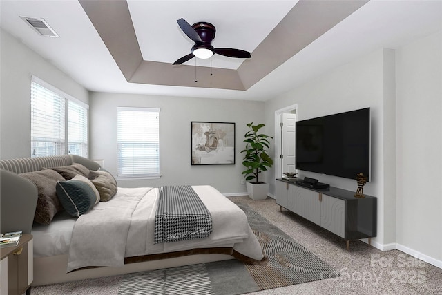 3251 Park S Station Blvd, Charlotte, NC 28210 - bedroom with a raised ceiling, light colored carpet, baseboards, and a ceiling fan