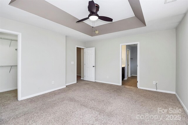 3251 Park S Station Blvd, Charlotte, NC 28210 - unfurnished bedroom with carpet flooring, a walk in closet, baseboards, and a closet