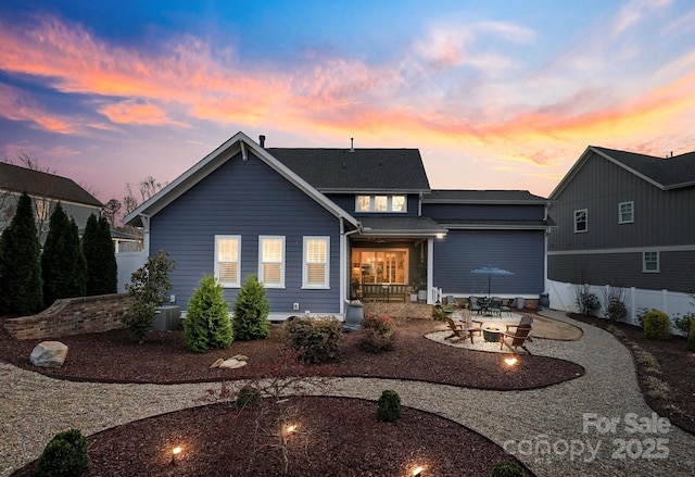 1502 Matthew Mcclure Cir, Davidson, NC 28036 - view of front of home with a patio area, a fire pit, and central AC unit