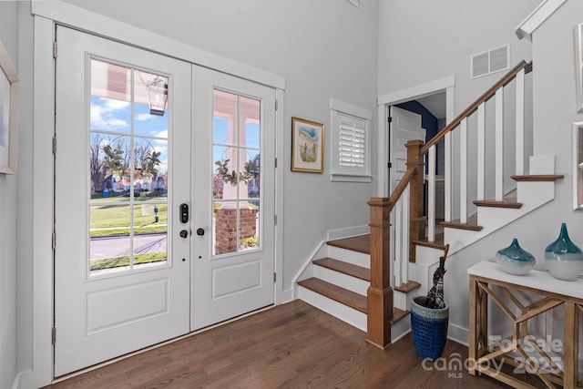 1502 Matthew Mcclure Cir, Davidson, NC 28036 - entrance foyer with french doors, dark wood-style flooring, stairway, plenty of natural light, and a towering ceiling