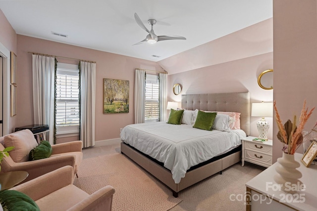 1502 Matthew Mcclure Cir, Davidson, NC 28036 - bedroom featuring multiple windows, light colored carpet, a ceiling fan, baseboards, and vaulted ceiling