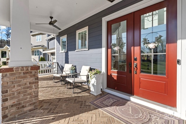 1502 Matthew Mcclure Cir, Davidson, NC 28036 - property entrance featuring covered porch, french doors, and a ceiling fan