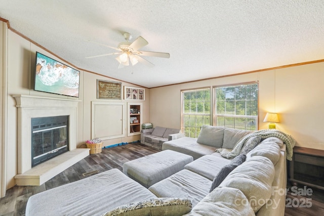 4122 Canal Rd, Marshville, NC 28103 - living area with ornamental molding, lofted ceiling, a ceiling fan, a textured ceiling, and wood finished floors