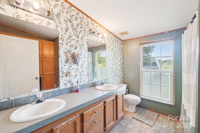 4122 Canal Rd, Marshville, NC 28103 - full bathroom featuring wallpapered walls, toilet, tile patterned floors, double vanity, and crown molding