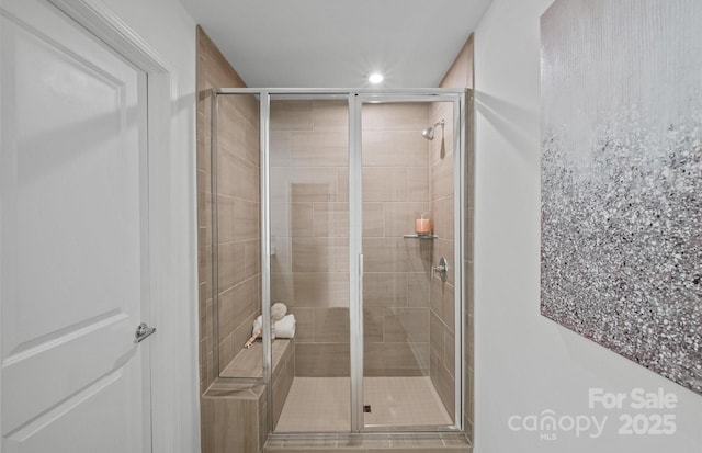 full bathroom featuring a shower stall and recessed lighting