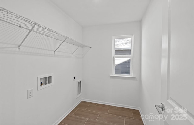 washroom featuring hookup for an electric dryer, washer hookup, baseboards, and wood tiled floors