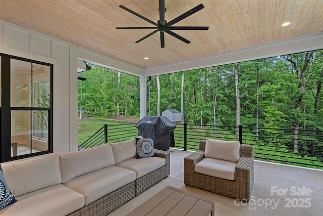 9564 Regent Dr, Davidson, NC 28036 - sunroom / solarium featuring a ceiling fan, an outdoor hangout area, and a forest view