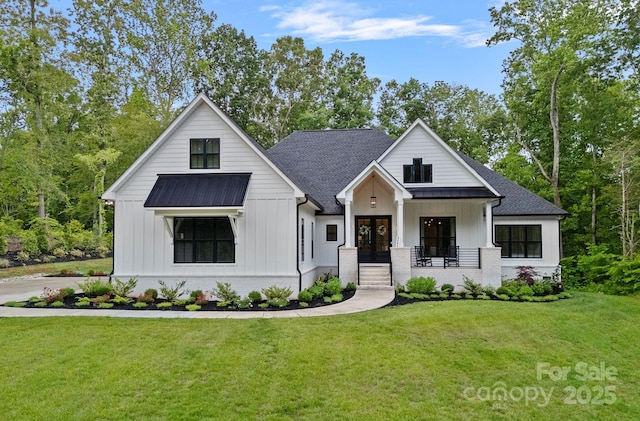 9564 Regent Dr, Davidson, NC 28036 - modern inspired farmhouse with a front lawn, french doors, board and batten siding, and brick siding