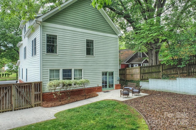 back of house featuring a patio area