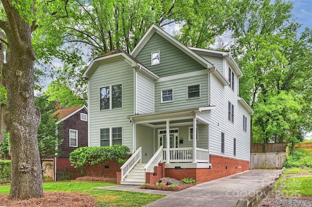 traditional-style home with crawl space and a porch