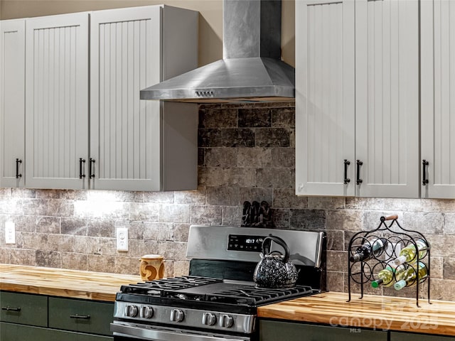 1846 Utah Mountain Rd, Waynesville, NC 28785 - kitchen with wooden counters, gas range, wall chimney range hood, and green cabinets