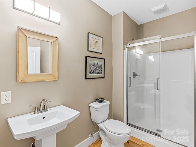 1846 Utah Mountain Rd, Waynesville, NC 28785 - full bathroom with a shower stall, a sink, toilet, and wood finished floors