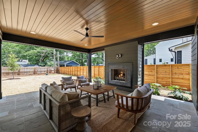 922 Everett Pl, Charlotte, NC 28205 - view of patio featuring a fenced backyard and an outdoor living space with a fireplace