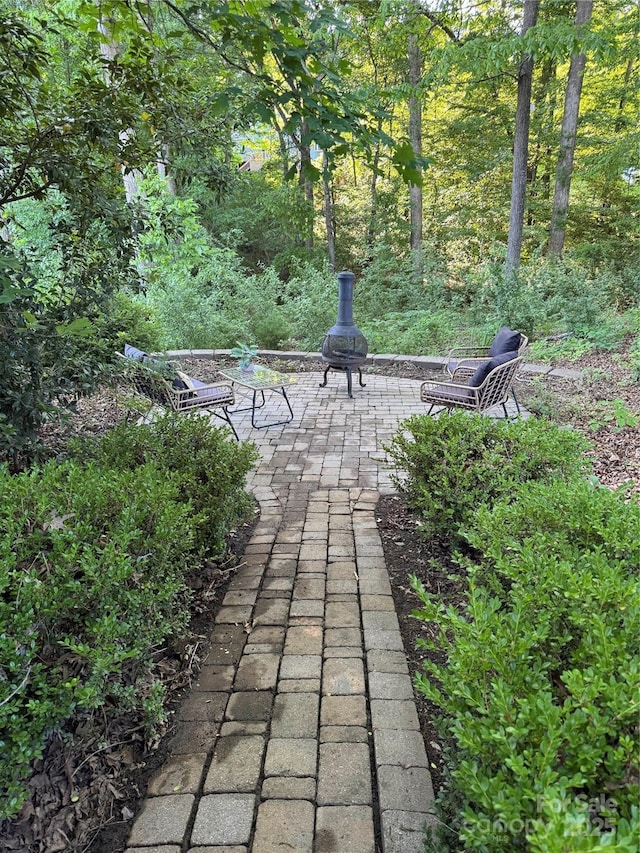 surrounding community featuring a patio area