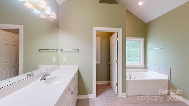 full bath featuring baseboards, tile patterned floors, vanity, a bath, and high vaulted ceiling