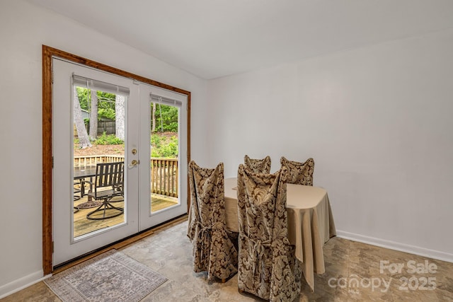 dining area featuring baseboards