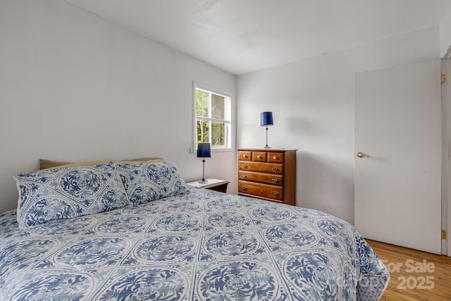 bedroom with wood finished floors