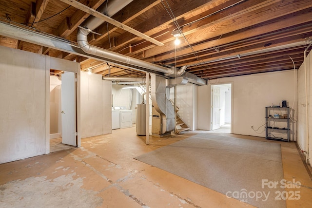 unfinished below grade area with washer and dryer, gas water heater, and stairway