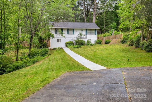 view of front of house with stairway and a shingled roof