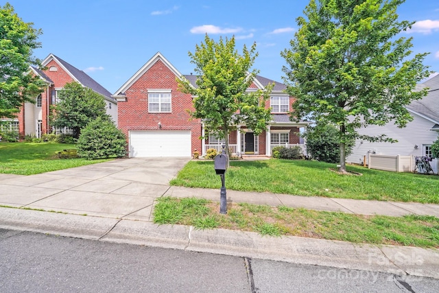6227 Castlecove Rd, Charlotte, NC 28278 - traditional-style home featuring brick siding, a garage, driveway, and a front yard
