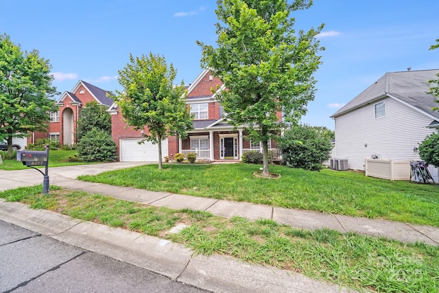 6227 Castlecove Rd, Charlotte, NC 28278 - view of front of home with driveway, a garage, a front lawn, and brick siding