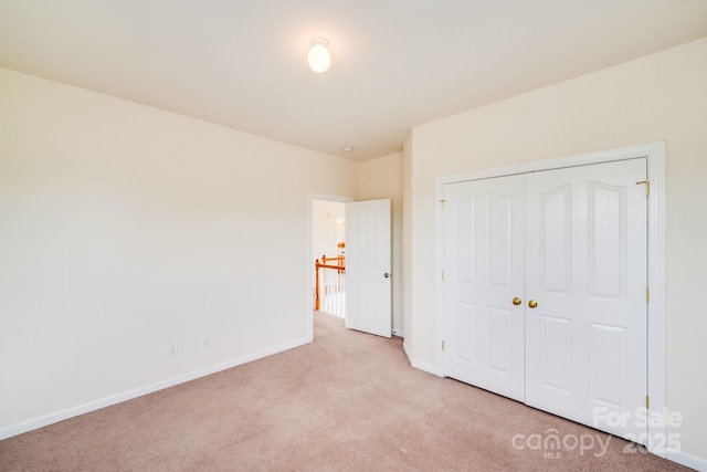 6227 Castlecove Rd, Charlotte, NC 28278 - unfurnished bedroom with light carpet and a closet