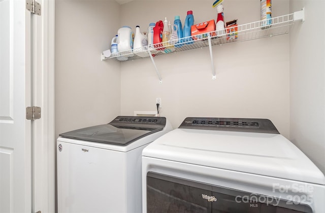 laundry room with washing machine and dryer